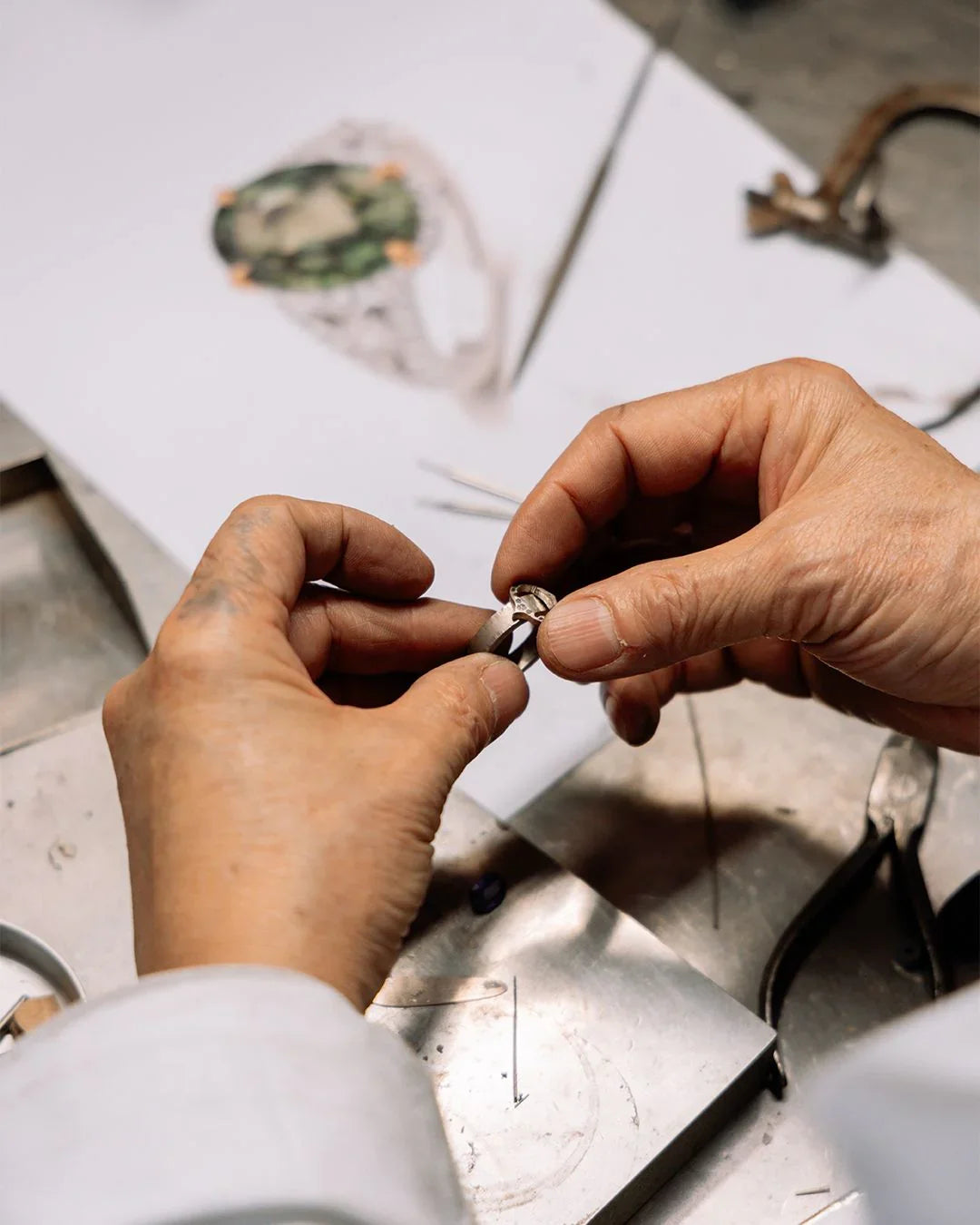 Jeweller hand-finishing a bespoke diamond ring in the HD Studio London workshop