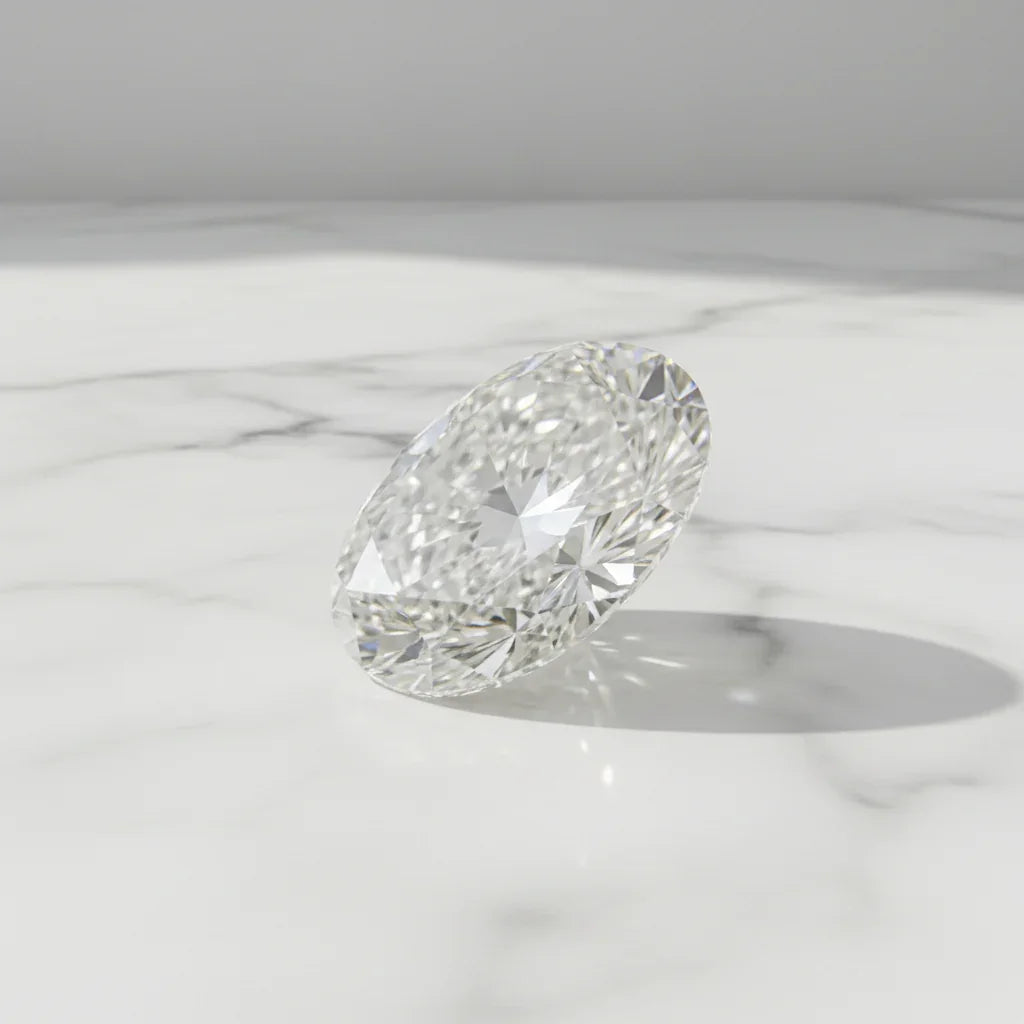 Sparkling oval cut loose diamond on marble surface, ideal for bespoke engagement rings